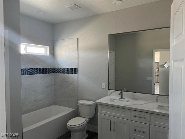 full bathroom with toilet, a sink, visible vents,  shower combination, and double vanity
