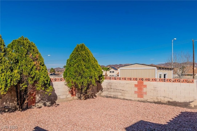 view of yard featuring a fenced backyard