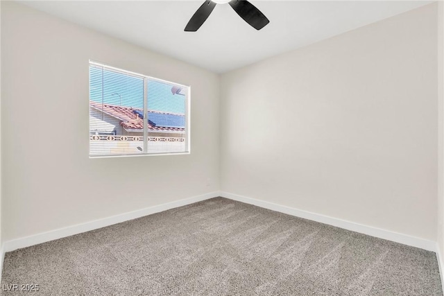 spare room with carpet floors, ceiling fan, and baseboards