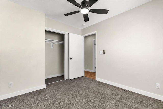 unfurnished bedroom with a ceiling fan, baseboards, dark colored carpet, and a closet