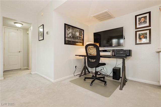 carpeted home office featuring visible vents and baseboards