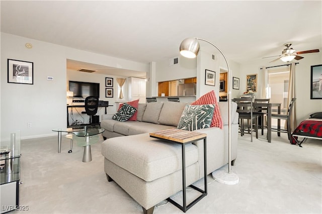 737 Oakmont Ave Unit 1202, Las Vegas, NV 89109 - living area featuring light carpet, a ceiling fan, and baseboards
