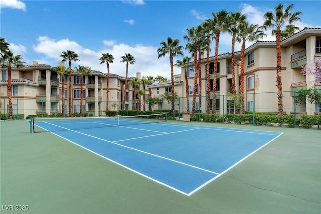 view of sport court with fence