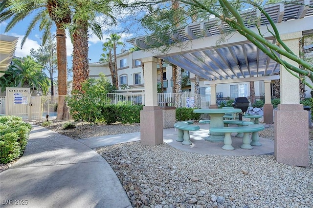 exterior space featuring fence and a pergola