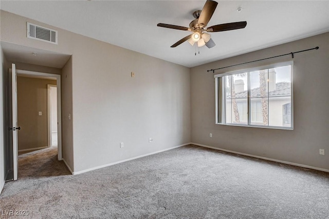 unfurnished room featuring a ceiling fan, baseboards, visible vents, and carpet flooring