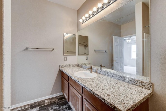 bathroom featuring vanity and baseboards