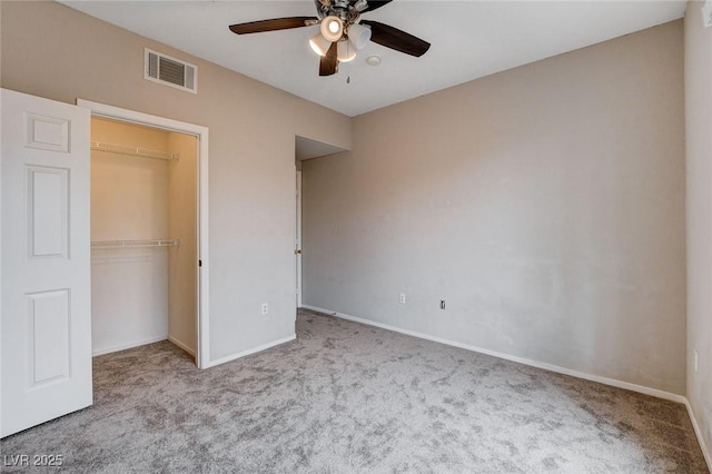 unfurnished bedroom featuring baseboards, a closet, visible vents, and carpet flooring