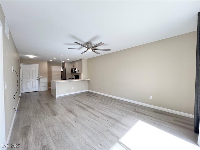 unfurnished living room with light wood-type flooring, ceiling fan, baseboards, and recessed lighting