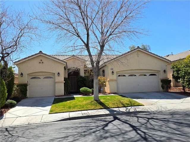 mediterranean / spanish home featuring stucco siding, a garage, and driveway