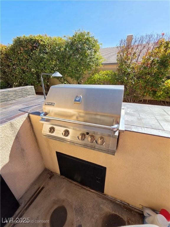 view of patio / terrace with grilling area and an outdoor kitchen