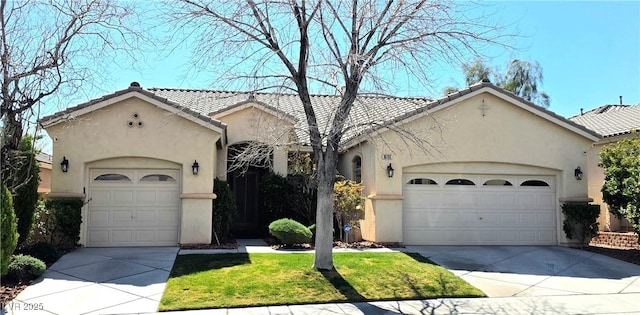 view of front of property with stucco siding and driveway