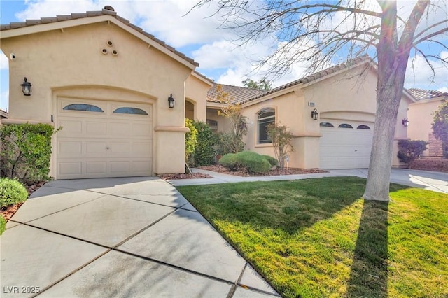 mediterranean / spanish-style house with stucco siding, concrete driveway, and a garage