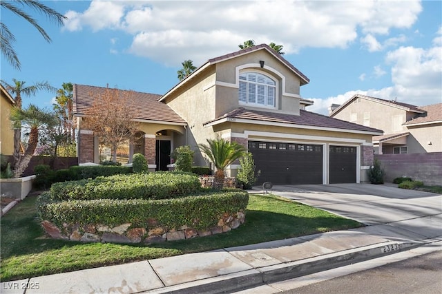 mediterranean / spanish-style home with concrete driveway, fence, an attached garage, and stucco siding