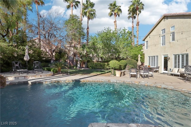 pool featuring a patio