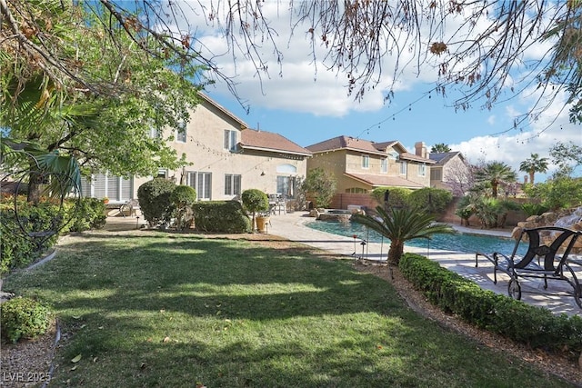 view of yard with a fenced backyard, an outdoor pool, and a patio