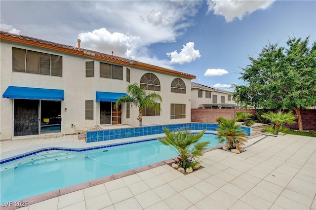 view of pool with a patio, fence, and a fenced in pool