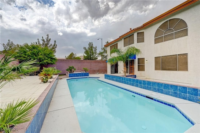 view of swimming pool featuring a fenced backyard, a fenced in pool, and a patio