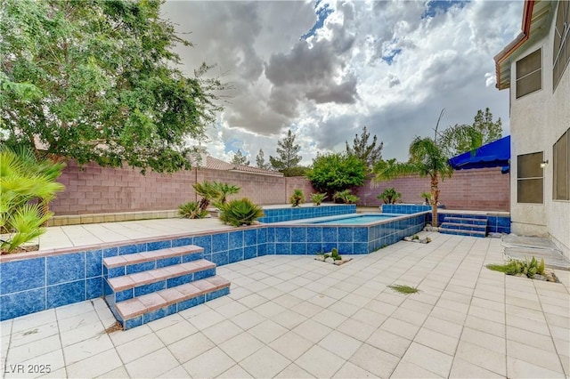 view of pool featuring a fenced backyard and a patio