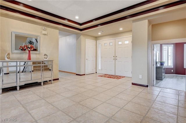 foyer featuring light tile patterned floors, recessed lighting, and baseboards