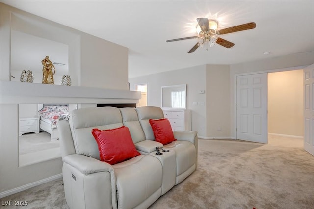 carpeted bedroom with a ceiling fan and baseboards