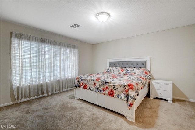 bedroom with carpet and visible vents