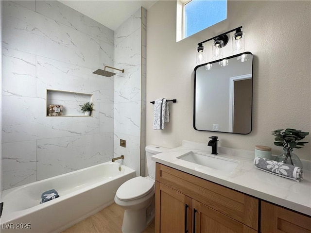 full bath with vanity, wood finished floors, toilet, and tub / shower combination