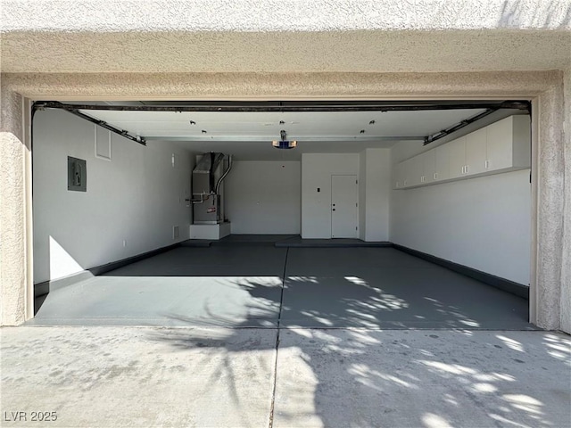 garage featuring heating unit, electric panel, a garage door opener, and baseboards