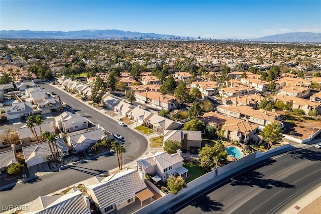 bird's eye view with a residential view and a mountain view