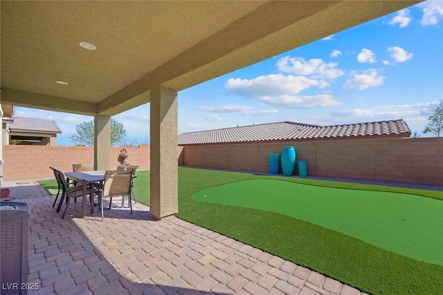 view of patio featuring outdoor dining space and a fenced backyard