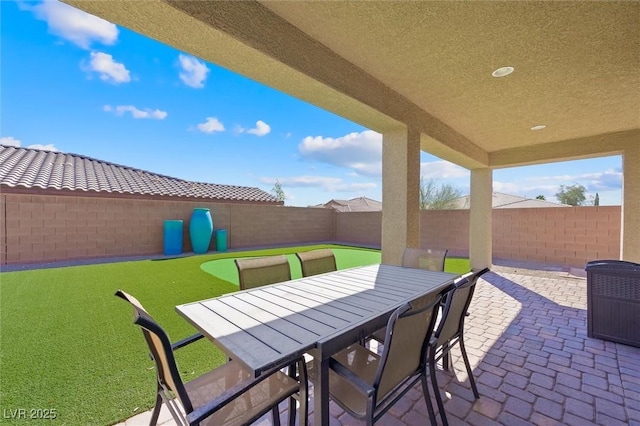 view of patio / terrace featuring outdoor dining area and a fenced backyard