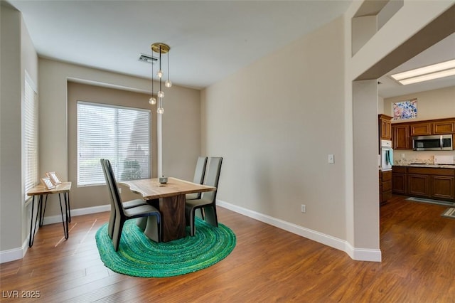 9816 Gerald Ct, Las Vegas, NV 89134 - dining area featuring dark wood-style floors and baseboards