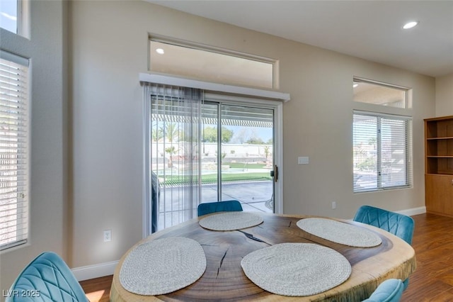 dining area with recessed lighting, baseboards, and wood finished floors