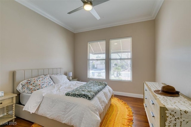 bedroom with dark wood-style floors, crown molding, baseboards, and ceiling fan