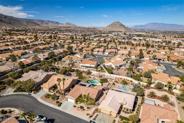 birds eye view of property with a residential view and a mountain view