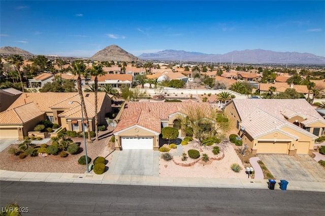 aerial view featuring a residential view and a mountain view