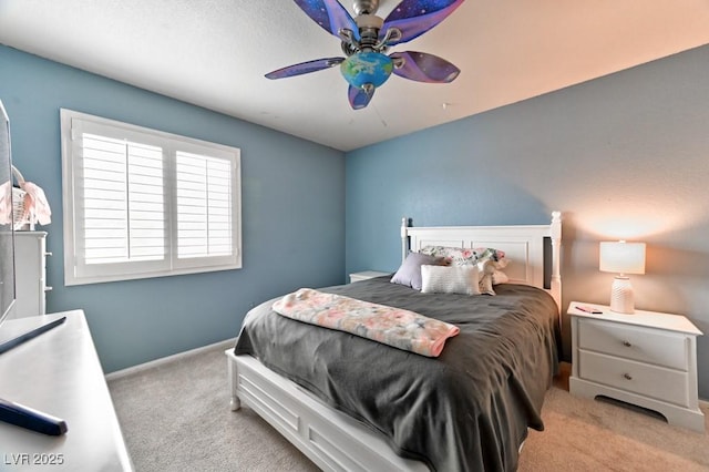 bedroom with carpet, baseboards, and ceiling fan