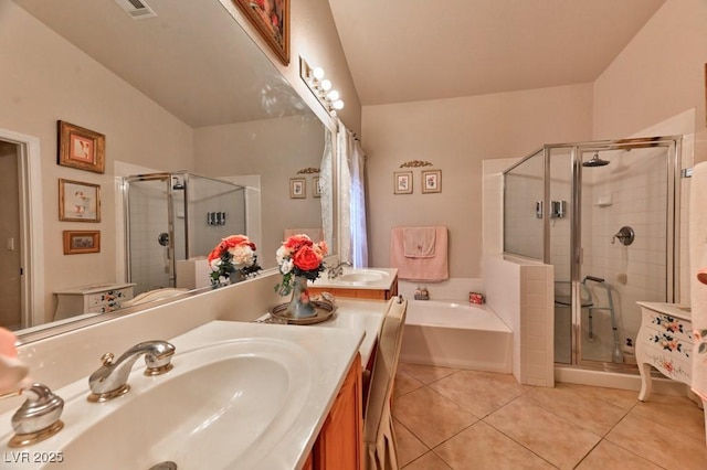 full bathroom featuring tile patterned flooring, a shower stall, vanity, and a bath