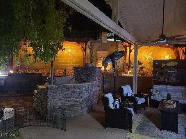 view of patio with outdoor lounge area and a ceiling fan