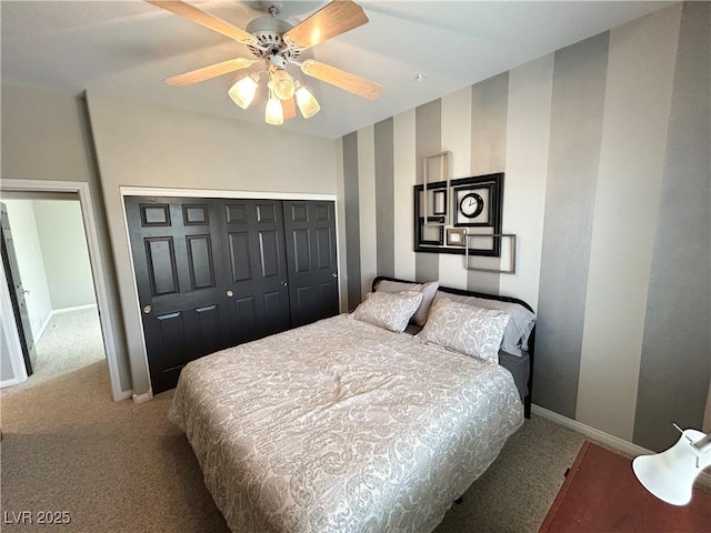 bedroom featuring a closet, baseboards, a ceiling fan, and carpet flooring
