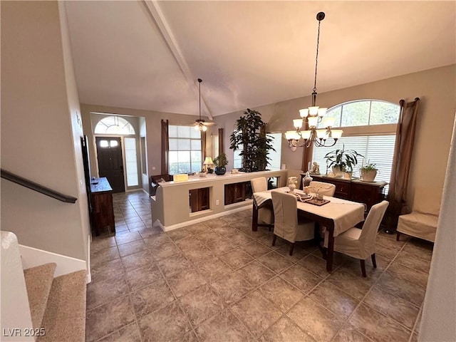 dining area with lofted ceiling with beams, ceiling fan with notable chandelier, stairs, and a wealth of natural light