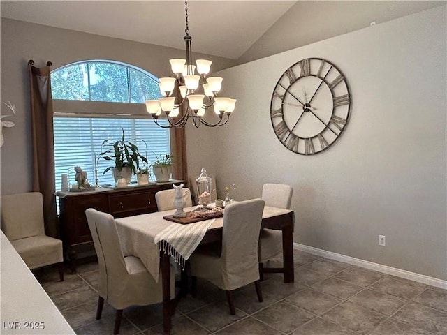 dining space with vaulted ceiling, baseboards, and a notable chandelier