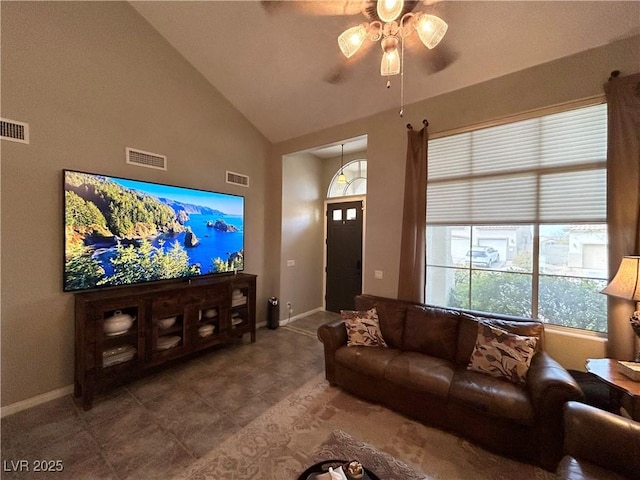 living area with high vaulted ceiling, baseboards, visible vents, and a ceiling fan