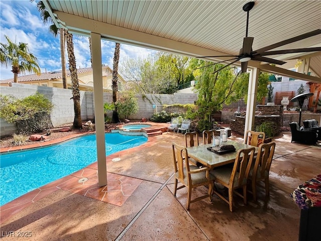 view of swimming pool featuring a patio, ceiling fan, a fenced backyard, outdoor dining area, and a pool with connected hot tub