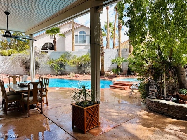 view of pool featuring a fenced in pool, outdoor dining space, a patio area, fence, and an in ground hot tub