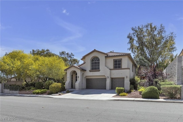 3047 Whispering Crest Dr, Henderson, NV 89052 - mediterranean / spanish house with a garage, stucco siding, concrete driveway, and a tiled roof