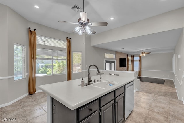 3047 Whispering Crest Dr, Henderson, NV 89052 - kitchen featuring ceiling fan, stainless steel dishwasher, a sink, open floor plan, and light countertops