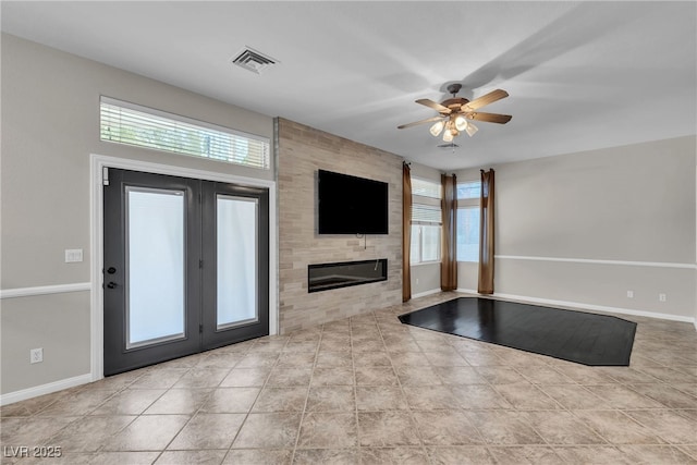 3047 Whispering Crest Dr, Henderson, NV 89052 - unfurnished living room with a ceiling fan, healthy amount of natural light, and baseboards
