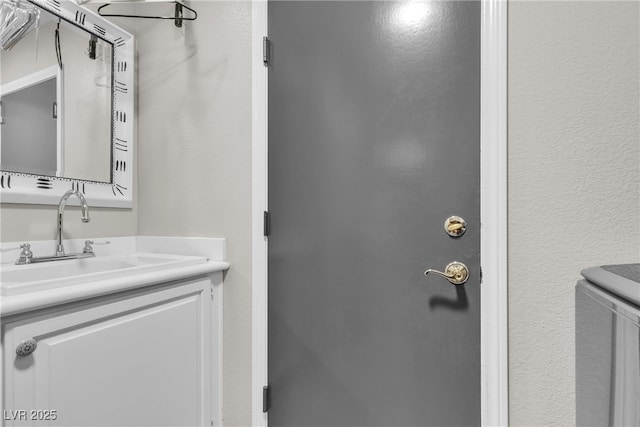 3047 Whispering Crest Dr, Henderson, NV 89052 - washroom with a sink and a textured wall