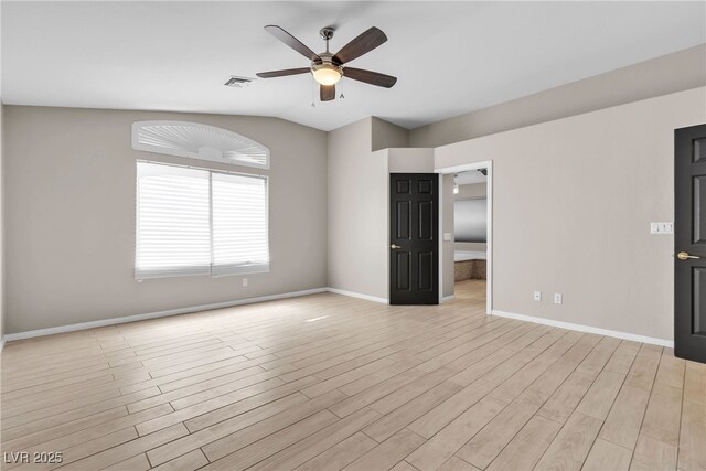 3047 Whispering Crest Dr, Henderson, NV 89052 - spare room with a ceiling fan, baseboards, light wood finished floors, and vaulted ceiling