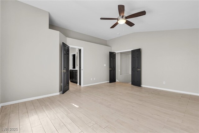 3047 Whispering Crest Dr, Henderson, NV 89052 - unfurnished room with ceiling fan, baseboards, light wood-style floors, and vaulted ceiling